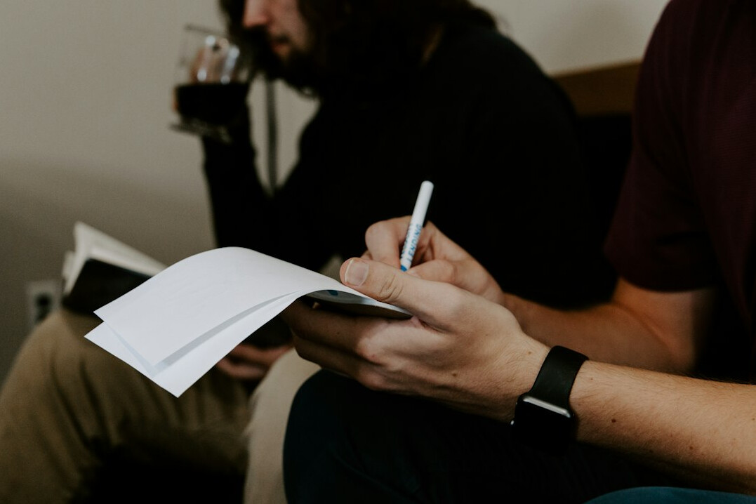 agent taking notes meeting